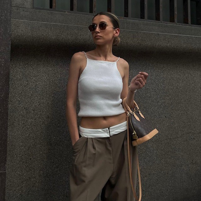 woman in white tank top and brown lowrise pants