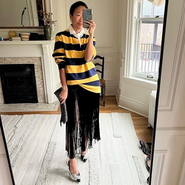 woman in a rugby shirt with fringe skirt