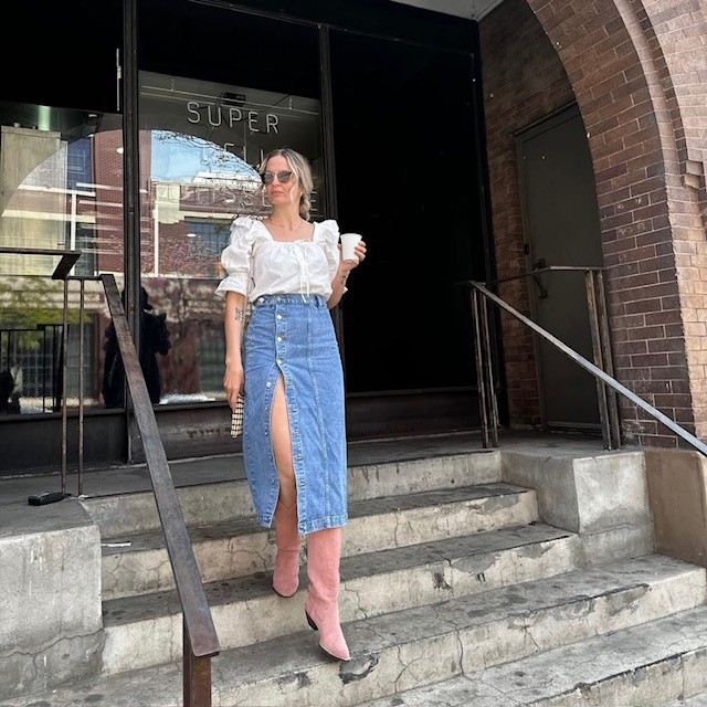 woman in boho blouse and long denim skirt