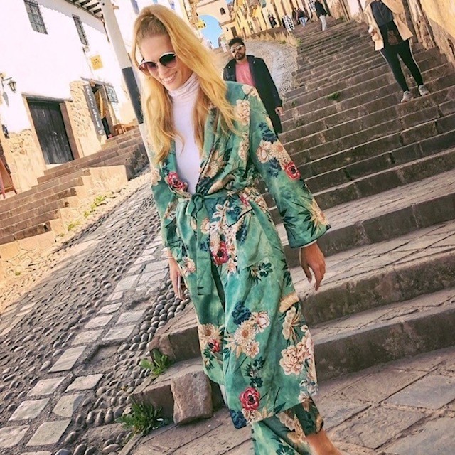 woman wearing a tropical print robe coat