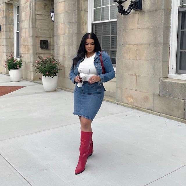 woman wearing denim skirt, denim jacket, white tee, and red cowboy boots