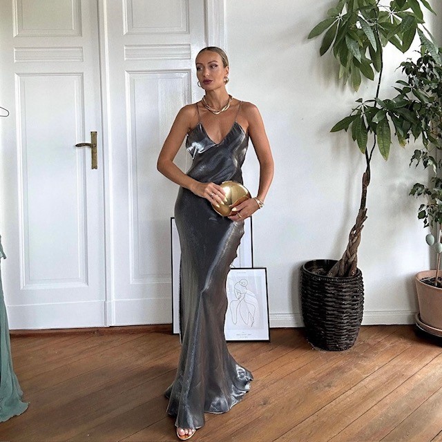 woman wearing floor-length silver metallic dress