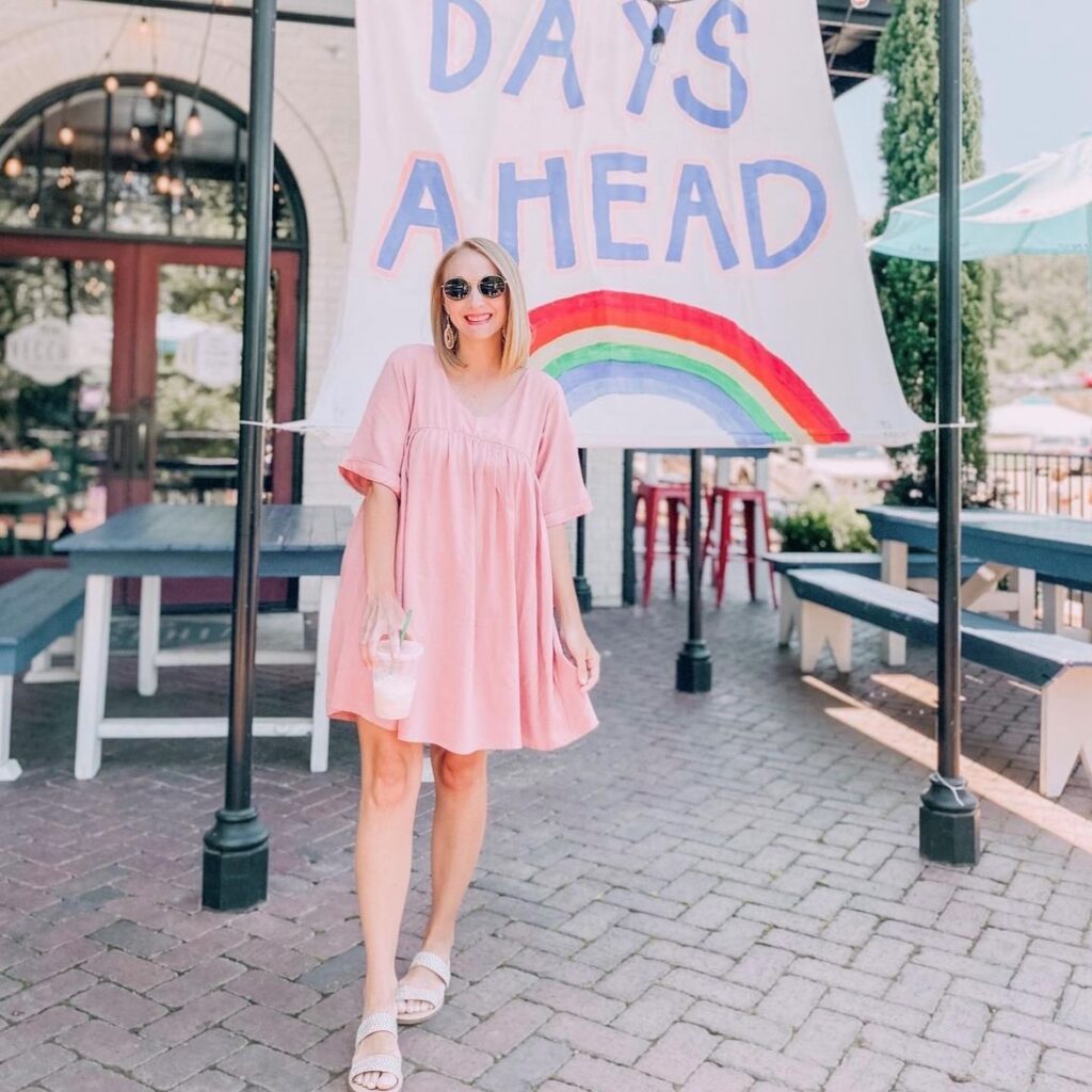 woman in pink trapeze dress