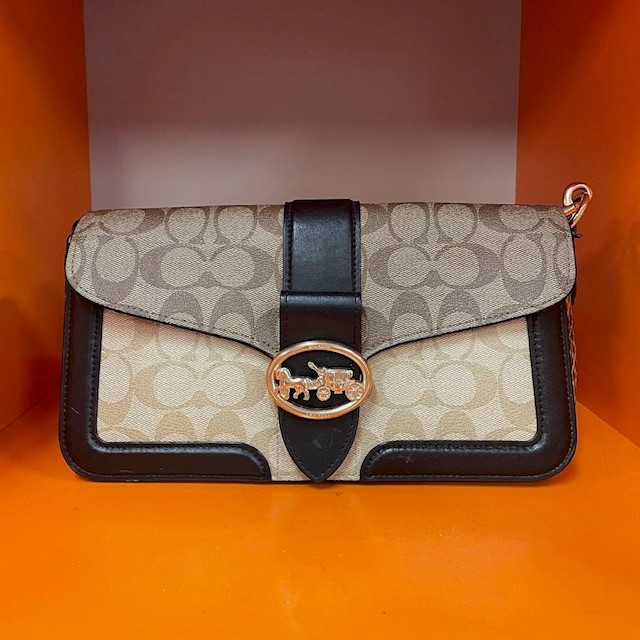 Coach logo bag, an example of popular 90's purses