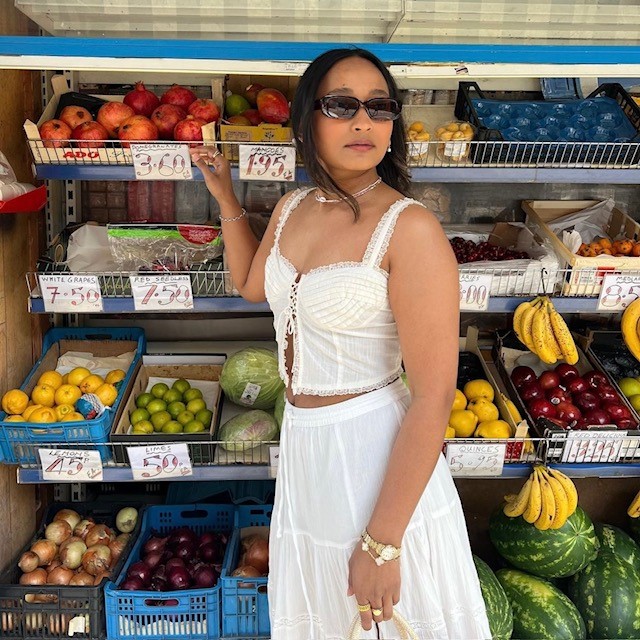 woman in matching top with maxi skirt