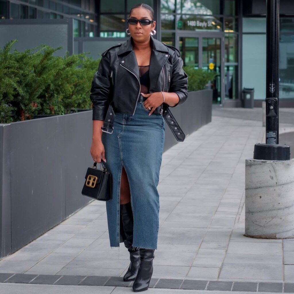 woman wearing one with a black sheer top, black leather jacket, and boots