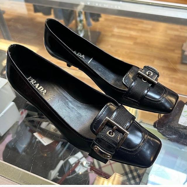 Black Prada buckle kitten heels