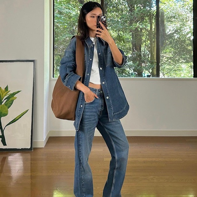 woman in jeans and matching shirt with cropped white t-shirt