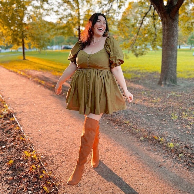 woman in army green version with tall tan boots