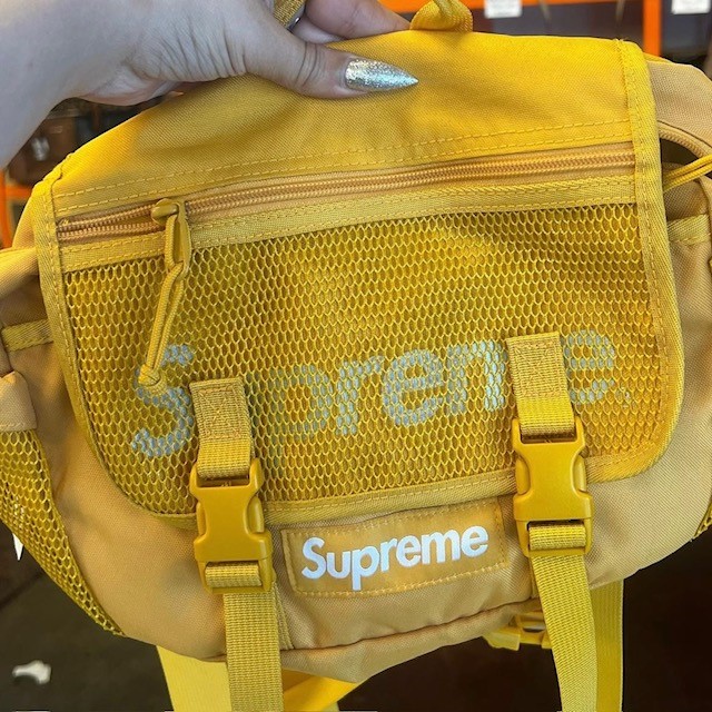 small yellow Supreme bag found in a thrift shop