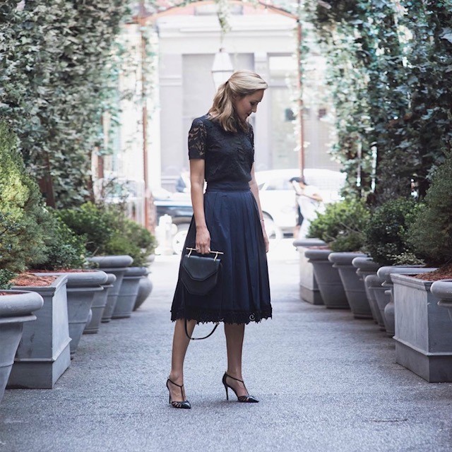 woman wearing navy and black with high heels