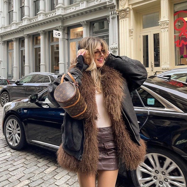 girl with a brown leather skirt with long jacket