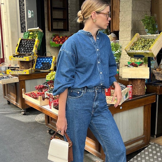 woman in blouse style top with jeans