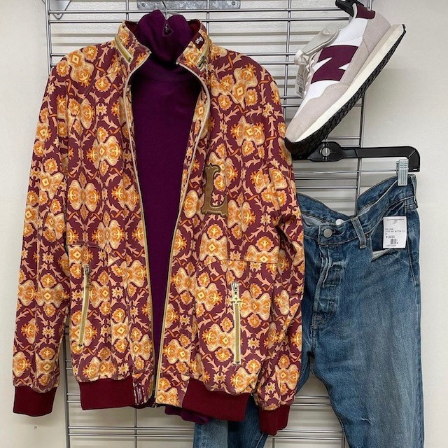 burgundy sweatshirt, paisley jacket, jeans, and white trainers