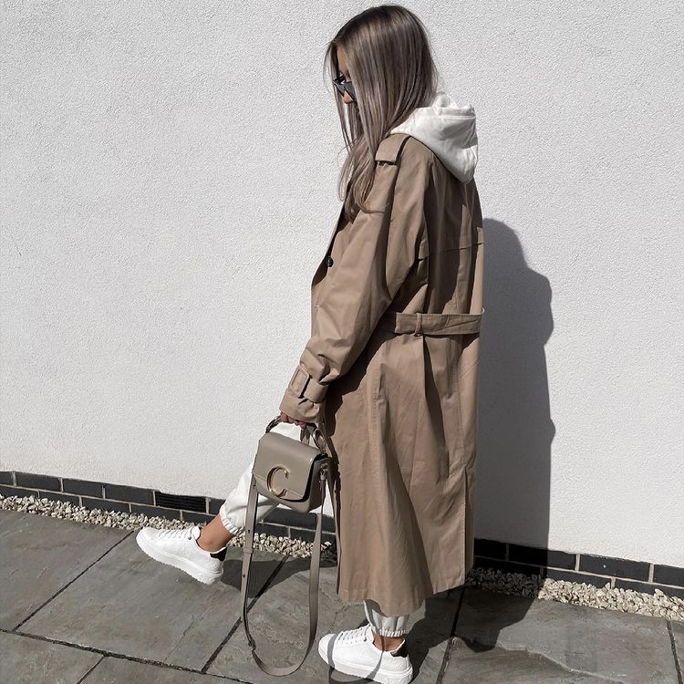 photo of woman in trench coat