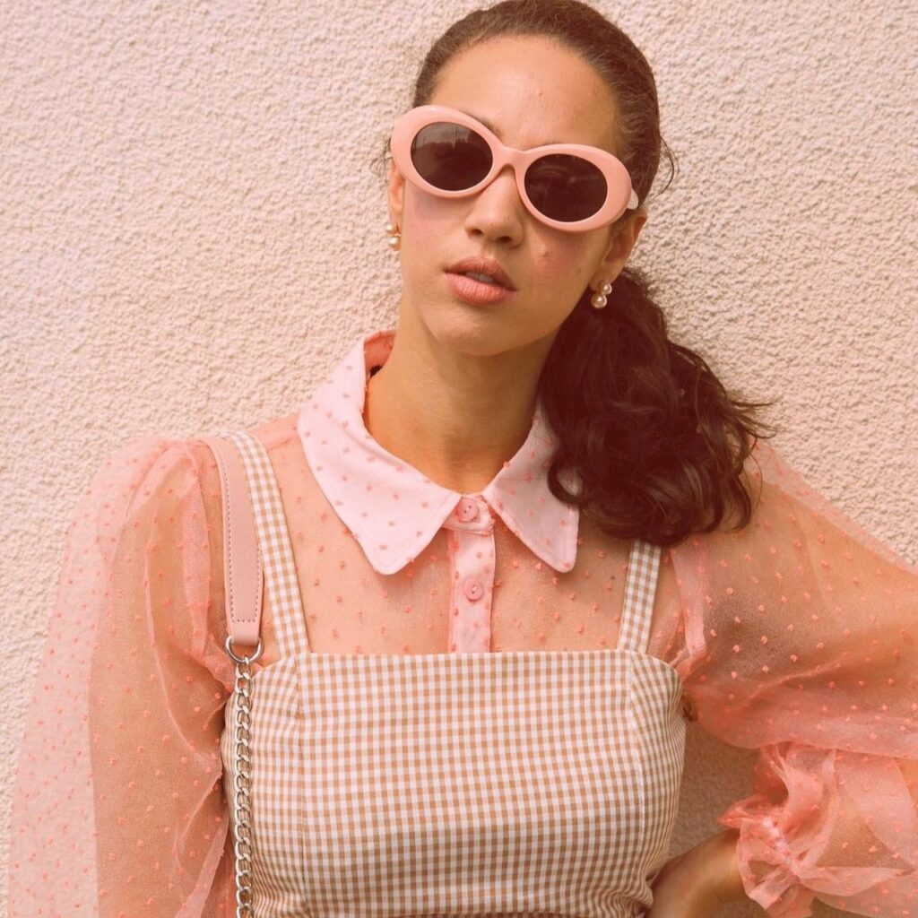 photo of person wearing a sheer top under a sundress