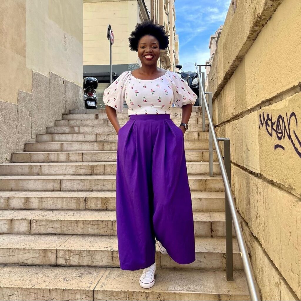 photo of person wearing purple pants and peasant blouse