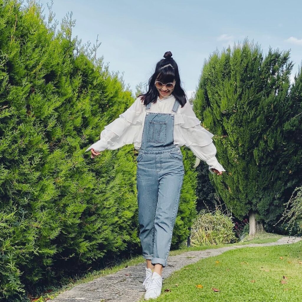 photo of girl with overalls and blouse