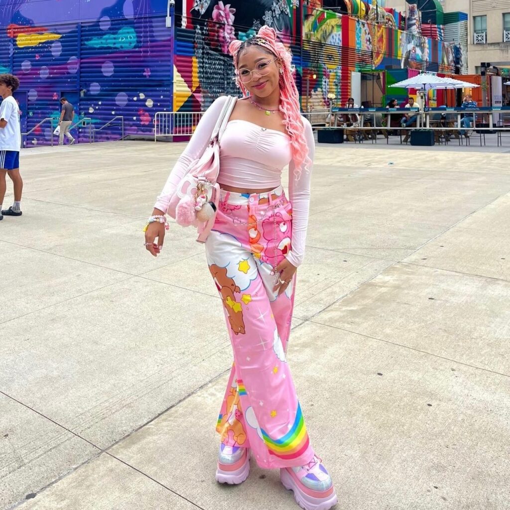 Woman wearing a pink outfit with pink platform shoes