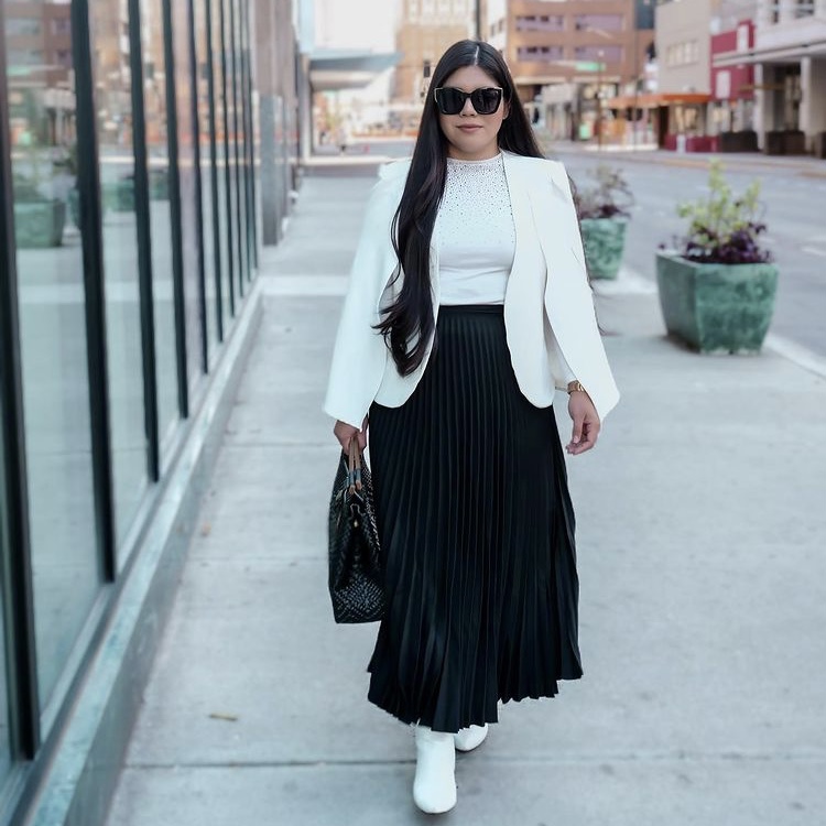 photo of person in blazer and skirt