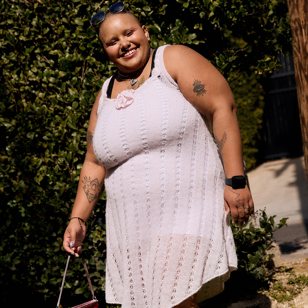 Tahra wearing a pink crochet dress